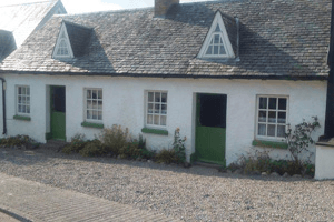 Whitewashed exterior of The Weavers Cottages in County Carlow