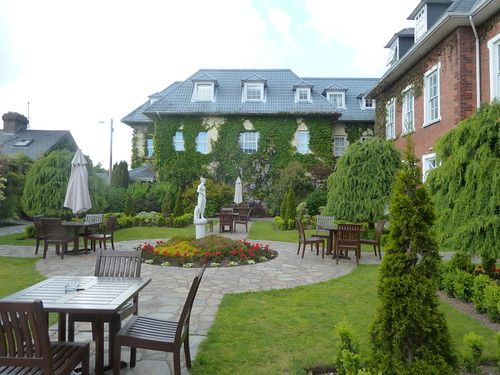 Garden courtyard and ivy-covered buildings at Hayfield Manor Hotel in Cork