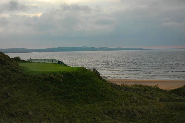 The coastal fourteenth hole at the Doonbeg golf links and hotel property in County Clare