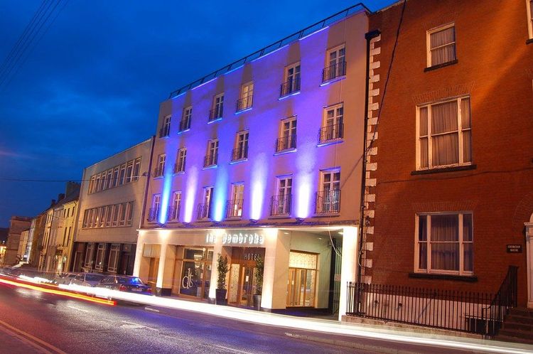 Illuminated frontage of the Pembroke Hotel in Kilkenny city at dusk