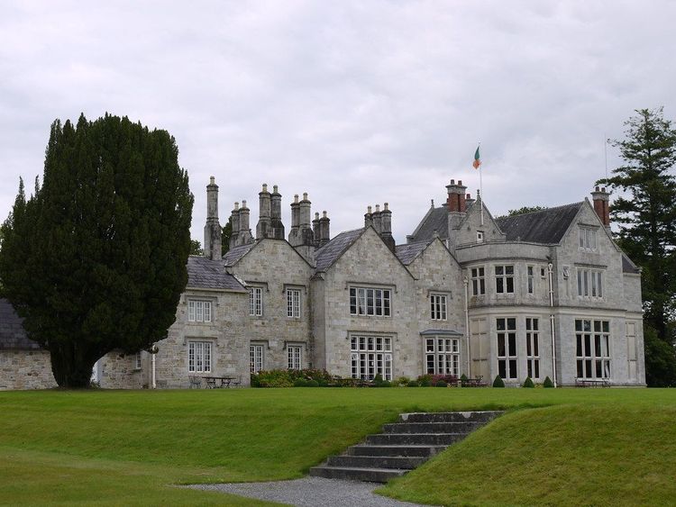 Stone façade and formal lawn at Lough Rynn Castle in County Leitrim