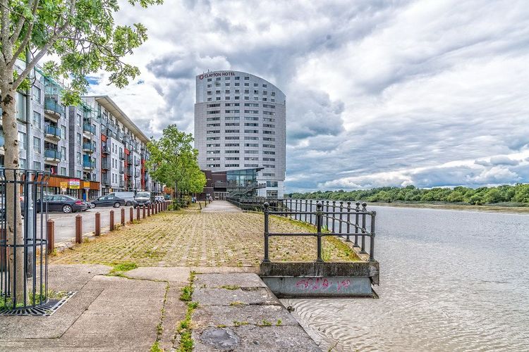Clayton Hotel Limerick tower beside the River Shannon at Steamboat Quay